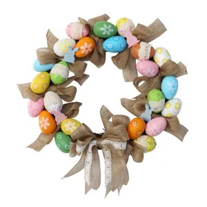 Easter egg wreath with burlap bows and colorful eggs for holiday door hanging decoration.