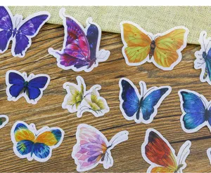 Closeup of colorful washi butterfly stickers, perfect for DIY journaling and scrapbooking details.