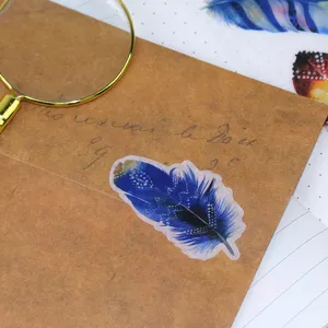 Dreamy blue feather washi sticker for journal decoration, cute stationery scrapbooking supply.
