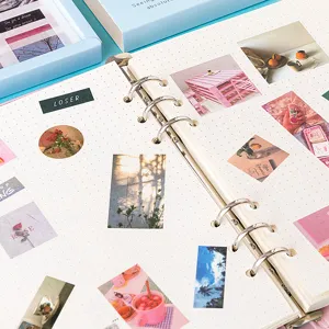 Aesthetic dotted loose-leaf notebook binder with cute stickers for DIY journaling.