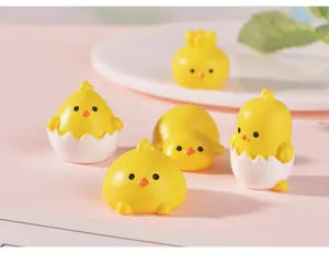 Close-up details of adorable resin chick figurines, ideal for miniature dollhouse decor.