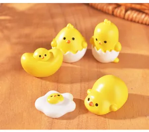 Cute resin chick miniatures set for dollhouse and DIY crafts, vibrant yellow eggshell design.