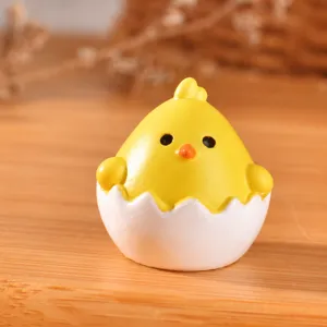 Mini resin chick in eggshell figurine detail, close up view, cute dollhouse decor ornament