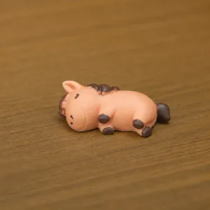 Miniature resin sleeping horse figurine detail view showing compact size and weight.