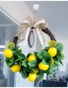 Ghirlanda di limoni artificiali con fiocco in juta foglie verdi per decorazione murale