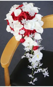 Waterfall bridal bouquet detail shot red white roses PU calla lilies crystal brooch floral design