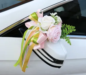 Wedding car rearview mirror artificial flower decoration with roses and colorful ribbons.
