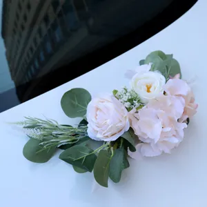 Artificial flower decoration for wedding car, simulation rose and eucalyptus leaf arrangement.