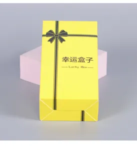 Creative yellow gift blind box packaging with black ribbon print for kids toys and party favors