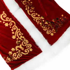Detailed view of red velvet Christmas costume fabric with gold foil print and white fur trim.