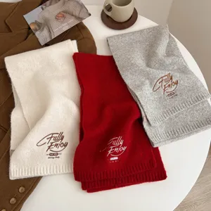 Cozy winter knitted scarf for women, solid color thick warm neck wrap with stylish embroidery detail.
