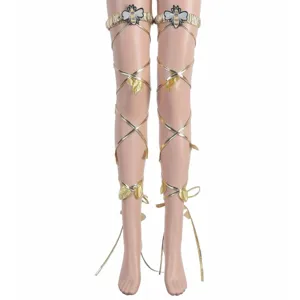 Detailed view of gold leg straps featuring delicate bee appliques and leaf charms for costume.