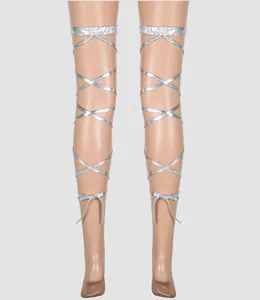Metallic silver strappy leg wraps lace-up hosiery detail shot for edgy fashion looks.