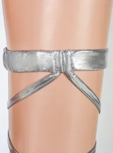 Close-up detail of silver metallic leg harness strap accessory, shiny finish, perfect for cosplay.