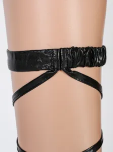 Black patent leather strap detail, sexy thigh garter or hosiery accessory, glossy finish.