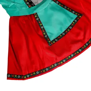 Detailed shot of Oktoberfest beer festival costume featuring red skirt and embroidered floral trim.
