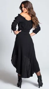 Detail view showing the back of the black off-shoulder vintage high-low dress with ruffle hem.