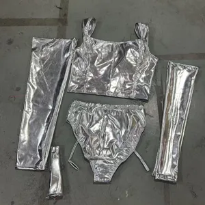 Metallic silver cosplay costume set including crop top shorts and leg covers for women.