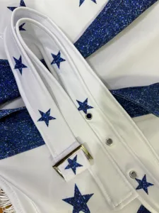 Cheerleader costume detail view featuring a white belt and blue glitter star pattern design.