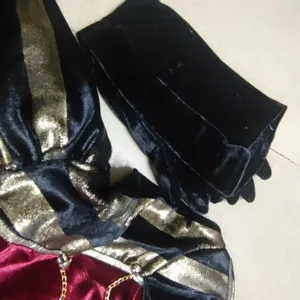 Black and red gothic pirate costume detail glove and velvet fabric for Halloween cosplay.