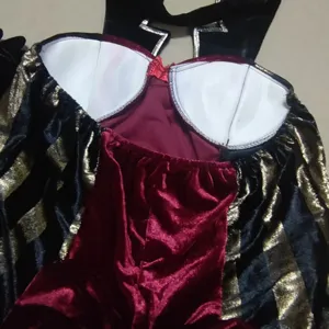 Red velvet black gold striped pirate costume detail, gothic style corset top, Halloween party.