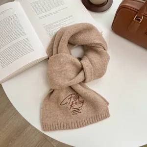 Cozy knitted winter scarf in chic khaki color with stylish embroidery design for women.