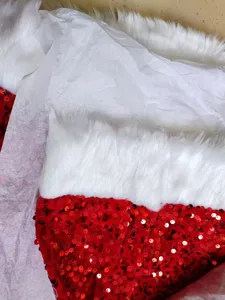 Red sequin Santa costume detail view featuring white plush faux fur trim for holiday festive wear.