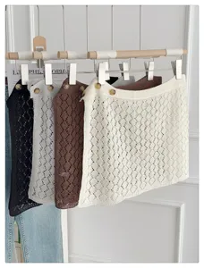 Korean style hollow knit skirt detail, versatile layering piece for spring and summer fashion.