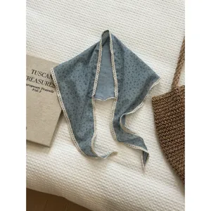 Detailed view of vintage floral lace triangle scarf, lightweight neckerchief for sunny days.