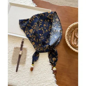 Vintage floral triangle scarf for women, cotton linen kerchief with beads and ties for daily wear.