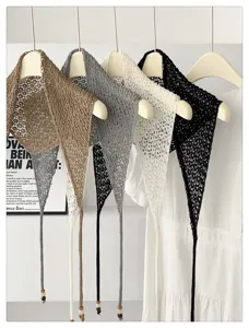 Hollow knit triangular scarf shawl with beading, stylish layered accessory for women.
