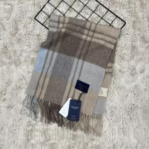 Detailed view of classic vintage plaid 100% Australian wool winter scarf with fringe.