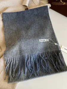 Korean style winter gradient wool scarf for women with soft tassel detail close up view.