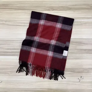 Classic red plaid winter scarf made from 100% Australian wool with stylish fringe details.
