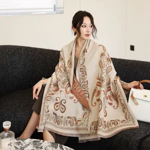 Detailed view of a cozy imitation cashmere shawl featuring a vintage paisley print design.