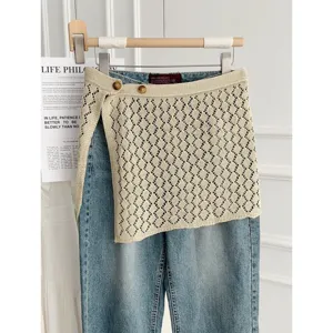 Korean style hollow knitted wrap skirt with denim jeans fashion layered outfit for women.
