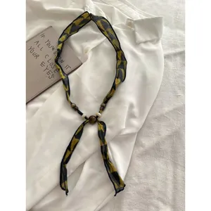 Vintage linen ribbon scarf necklace with wooden beads, elegant old money style accessory main.