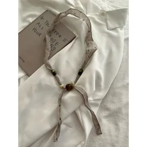 Vintage literary fabric wooden bead scarf necklace, elegant linen ribbon design for women.