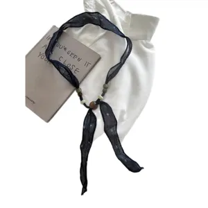 Vintage black sheer ribbon necklace with wooden beads, elegant minimalist chic aesthetic jewelry.