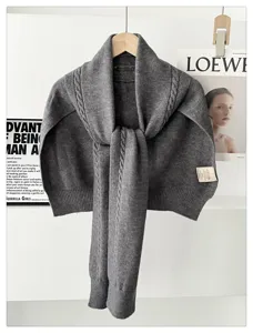 Grey knit wool blend shawl scarf sweater detail, cozy winter neck warmer and stylish layering.