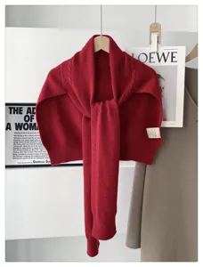 Red knit sweater shawl detail view, stylish winter layering wool scarf for cozy neck warmth.