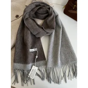 Classic two-tone wool scarf with elegant fringe detail, soft and warm for winter wear.