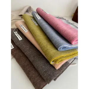 Cozy 100% wool winter scarf for women, classic tassel design with stylish color block.