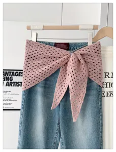 Knitted hollow-out solid color shawl triangle scarf styled with denim jeans detail view.