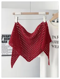 Red knitted hollow-out triangular scarf detail view, elegant neckwear and sunshade item.