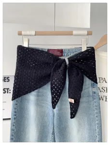 Knitted hollow-out triangular shawl detail, versatile solid color fashion scarf.