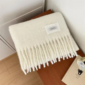 Soft solid color brushed wool scarf with lace patch and stylish fringe detail for cold winter.