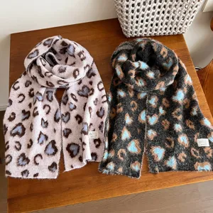 Cozy winter leopard print wool scarf detail showing soft fabric and cute heart pattern texture.