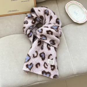 Detail view of the cozy knitted winter scarf with soft wool blend and stylish pattern texture.