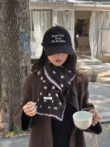 Women winter warm polka dot wool scarf and casual embroidered baseball cap outfit detail